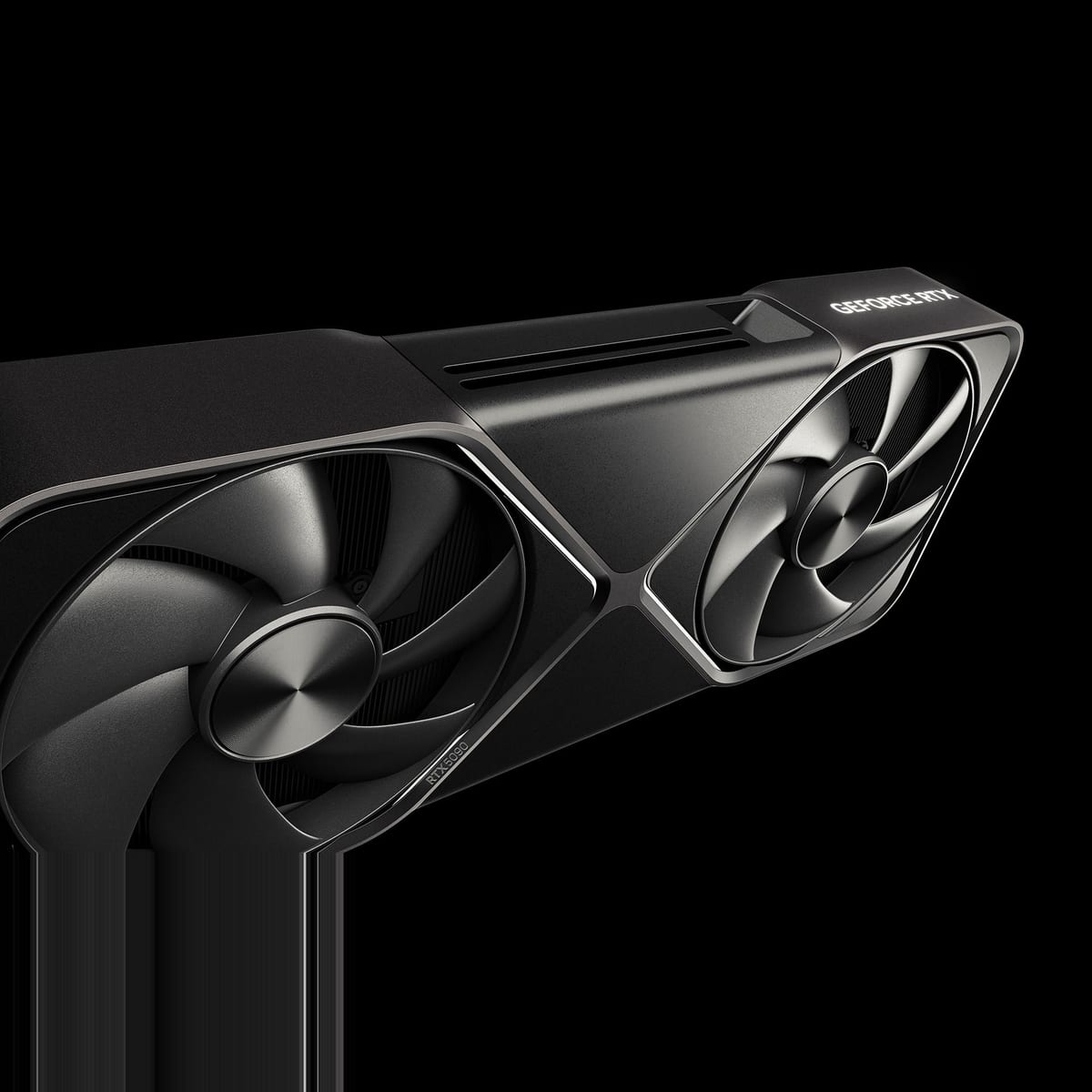 NVIDIA GeForce RTX 5090 Founders Edition seen from a high three-quarter angle against a black background. The dual-slot card has a dark gunmetal shroud with two large axial fans, one near each end, and a slim black midsection with GEFORCE RTX lettering along the top edge. The fan blades are curved and glossy and the card edges have a brushed metal finish.